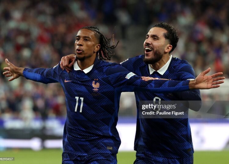 Michael Olise of France celebrates scoring his team’s first goal with teammate Rayan Cherki during the UEFA Nations League 2026/27 group phase match between France and Italy (Photo by Pauline Figuet/Getty Images)