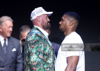 Tyson Fury and Anthony Joshua face off during the announcement for the upcoming Tyson Fury vs. Anthony Joshua fight (Photo by Richard Pelham/Getty Images for Netflix)