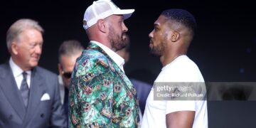 Tyson Fury and Anthony Joshua face off during the announcement for the upcoming Tyson Fury vs. Anthony Joshua fight (Photo by Richard Pelham/Getty Images for Netflix)