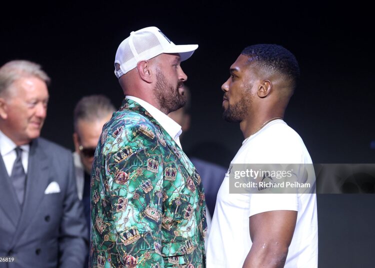 Tyson Fury and Anthony Joshua face off during the announcement for the upcoming Tyson Fury vs. Anthony Joshua fight (Photo by Richard Pelham/Getty Images for Netflix)