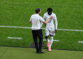 Gareth Southgate, Head Coach of England, interacts with Kobbie Mainoo of England as he leaves the field after being substituted during the UEFA EURO 2024 final match between Spain and England at Olympiastadion on July 14, 2024 in Berlin, Germany. (Photo by Justin Setterfield/Getty Images)