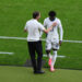 Gareth Southgate, Head Coach of England, interacts with Kobbie Mainoo of England as he leaves the field after being substituted during the UEFA EURO 2024 final match between Spain and England at Olympiastadion on July 14, 2024 in Berlin, Germany. (Photo by Justin Setterfield/Getty Images)