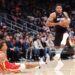 Dyson Daniels #5 of the Atlanta Hawks falls to the floor as Giannis Antetokounmpo #7 of the Miami Heat drives to the basket during the second quarter (Photo by Kevin C. Cox/Getty Images)