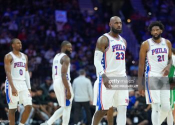 LeBron James #23, Joel Embiid #21, Jaylen Brown #7, and Tyrese Maxey #0 of the Philadelphia 76ers look on against the Boston Celtics (Photo by Mitchell Leff/Getty Images)