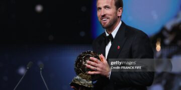 England and Bayern Munich forward Harry Kane smiles after receiving the Ballon d'Or award for the best male footballer during the 2026 Ballon d'Or (Photo by FRANCK FIFE / AFP via Getty Images)