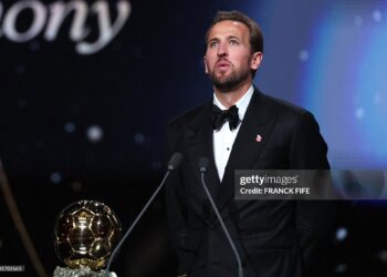 England and Bayern Munich forward Harry Kane reacts after receiving the Ballon d'Or award for the best male footballer during the 2026 Ballon d'Or (Photo by FRANCK FIFE / AFP via Getty Images)