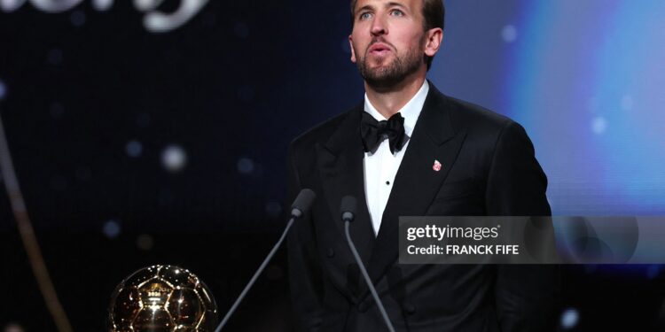England and Bayern Munich forward Harry Kane reacts after receiving the Ballon d'Or award for the best male footballer during the 2026 Ballon d'Or (Photo by FRANCK FIFE / AFP via Getty Images)