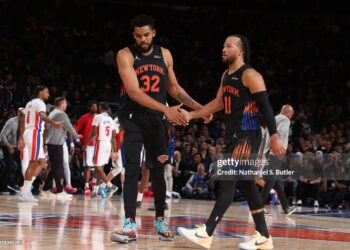 Karl-Anthony Towns #32, and Jalen Brunson #11 of the New York Knicks high five during the game against the Detroit Pistons (Photo by Nathaniel S. Butler/NBAE via Getty Images)
