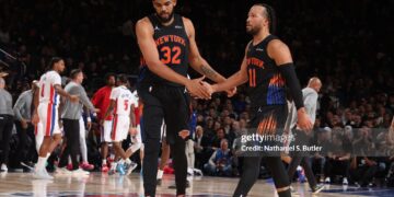 Karl-Anthony Towns #32, and Jalen Brunson #11 of the New York Knicks high five during the game against the Detroit Pistons (Photo by Nathaniel S. Butler/NBAE via Getty Images)