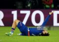 Khvicha Kvaratskhelia #7 of Paris Saint-Germain reacts after his injury during the UEFA Champions League 2026/27 League Phase MD3 match between Paris Saint-Germain and FC Barcelona (Photo by Xavier Laine/Getty Images)
