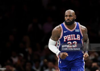 LeBron James #23 of the Philadelphia 76ers looks on during the first quarter of a preseason game against the Brooklyn Nets (Photo by Ishika Samant/Getty Images)