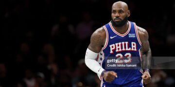 LeBron James #23 of the Philadelphia 76ers looks on during the first quarter of a preseason game against the Brooklyn Nets (Photo by Ishika Samant/Getty Images)