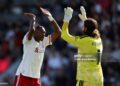 Jeremy Jacquet and Alisson Becker of Liverpool celebrate after the Premier League 2026/27 match between AFC Bournemouth and Liverpool FC (Photo by Steve Bardens/Getty Images)