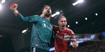 Liverpool goalkeeper Giorgi Mamardashvili celebrates victory with Kostas Tsimikas of Liverpool during the Carabao Cup Fourth Round match between Liverpool and Chelsea (Photo by Jacques Feeney/Offside/Offside via Getty Images)