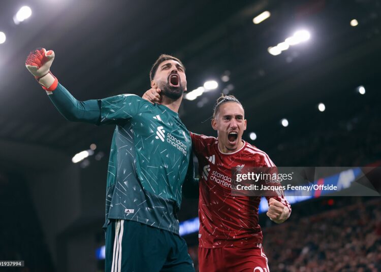 Liverpool goalkeeper Giorgi Mamardashvili celebrates victory with Kostas Tsimikas of Liverpool during the Carabao Cup Fourth Round match between Liverpool and Chelsea (Photo by Jacques Feeney/Offside/Offside via Getty Images)