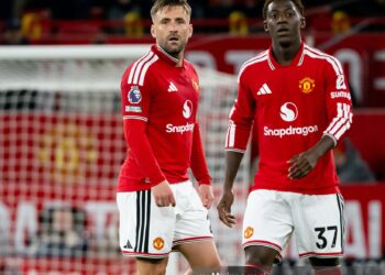 Luke Shaw and Kobbie Mainoo of Manchester United look on during the Premier League 2026/27 match between Manchester United and Tottenham Hotspur (Photo by Ash Donelon/Manchester United via Getty Images)