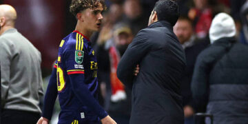 Mikel Arteta, Manager of Arsenal, talks to Max Dowman of Arsenal as he walks off the pitch after being sent off during the Carabao Cup Fourth Round match between Fleetwood Town and Arsenal at Highbury Stadium on October 27, 2026 in Fleetwood, England. (Photo by Lewis Storey/Getty Images)