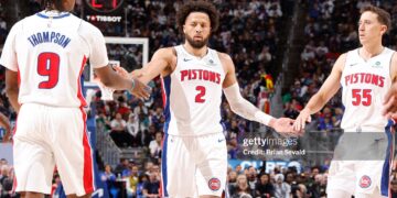 Cade Cunningham #2 and Duncan Robinson #55 of the Detroit Pistons high five during the game against the Boston Celtics (Photo by Brian Sevald/NBAE via Getty Images)