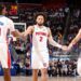 Cade Cunningham #2 and Duncan Robinson #55 of the Detroit Pistons high five during the game against the Boston Celtics (Photo by Brian Sevald/NBAE via Getty Images)