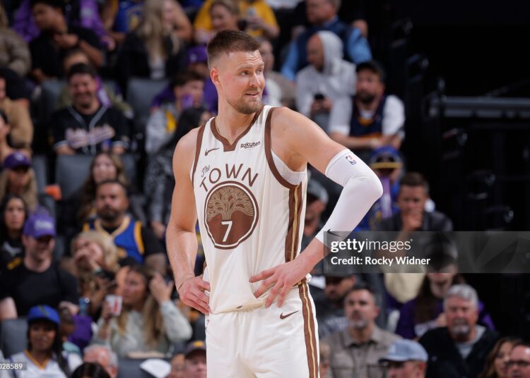 Kristaps Porzingis #7 of the Golden State Warriors looks on during the game against the Sacramento Kings (Photo by Rocky Widner/NBAE via Getty Images)