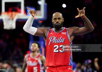 LeBron James #23 of the Philadelphia 76ers celebrates a three-pointer by Vj Edgecombe #77 (not pictured) during the second half of an Emirates NBA Cup game against the New York Knicks (Photo by Emilee Chinn/Getty Images)