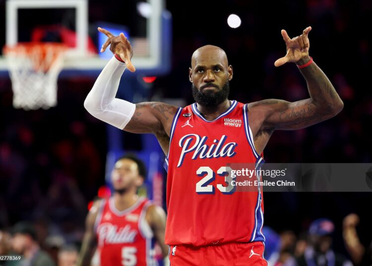 LeBron James #23 of the Philadelphia 76ers celebrates a three-pointer by Vj Edgecombe #77 (not pictured) during the second half of an Emirates NBA Cup game against the New York Knicks (Photo by Emilee Chinn/Getty Images)