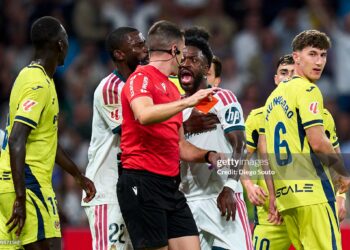 Vinicius Junior of Real Madrid CF argue with referee Isidro Diaz Mero Escuderos red card during the LaLiga EA Sports 2026/27 match between Real Madrid and Villarreal CF. (Photo by Diego Souto/Getty Images)