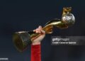 A Spain player holds up the FIFA Women's World Cup Trophy after the FIFA Women's World Cup Australia & New Zealand 2023 Final match between Spain and England at Stadium Australia on August 20, 2023 in Sydney, Australia. (Photo by Cameron Spencer/Getty Images)