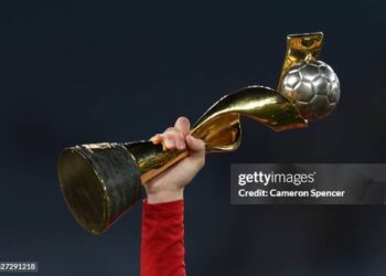 A Spain player holds up the FIFA Women's World Cup Trophy after the FIFA Women's World Cup Australia & New Zealand 2023 Final match between Spain and England at Stadium Australia on August 20, 2023 in Sydney, Australia. (Photo by Cameron Spencer/Getty Images)