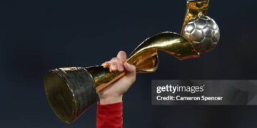 A Spain player holds up the FIFA Women's World Cup Trophy after the FIFA Women's World Cup Australia & New Zealand 2023 Final match between Spain and England at Stadium Australia on August 20, 2023 in Sydney, Australia. (Photo by Cameron Spencer/Getty Images)