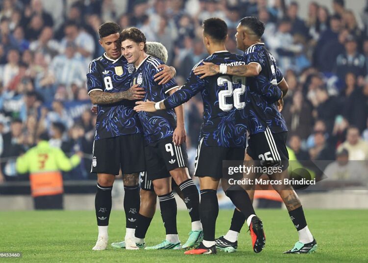 Julian Alvarez of Argentina celebrates his team's second goal with teammates scored by an own goal from Maumouni Diallo of Burkina Faso (not in frame) during the international friendly match between Argentina and Burkina Faso at Estadio Monumental Antonio V. Liberti on October 03, 2026 in Buenos Aires, Argentina. (Photo by Marcos Brindicci/Getty Images)