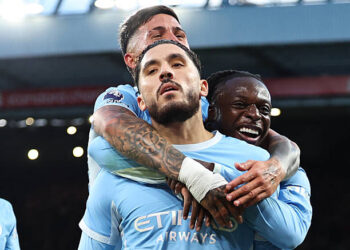Rayan Cherki of Manchester City celebrates scoring their third goal with Jeremy Doku, Enzo Fernandez during the Premier League 2026/27 match between Liverpool FC and Manchester City at Anfield on October 11, 2026 in Liverpool, England. (Photo by Robbie Jay Barratt - AMA/Getty Images)