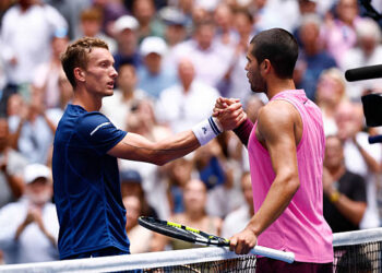 Spain's Carlos Alcaraz (R) and Czech Republic's Jiri Lehecka shake hands after Alcaraz won their men's quarterfinals round match on day ten of the US Open tennis tournament at the USTA Billie Jean King National Tennis Center in New York City on September 2, 2025. (Photo by Kena Betancur / AFP via Getty Images)