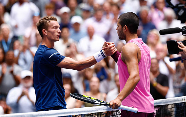 Spain's Carlos Alcaraz (R) and Czech Republic's Jiri Lehecka shake hands after Alcaraz won their men's quarterfinals round match on day ten of the US Open tennis tournament at the USTA Billie Jean King National Tennis Center in New York City on September 2, 2025. (Photo by Kena Betancur / AFP via Getty Images)