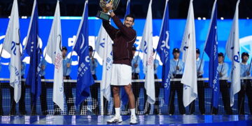 BEIJING, CHINA - OCTOBER 6: Novak Djokovic of Serbia pose with the trophy after winning against Alex De Minaur of Australia during their Men's Singles final match on day seven of China Open at the National Tennis Center on October 6, 2026 in Beijing, China. (Photo by Fred Lee/Getty Images)
