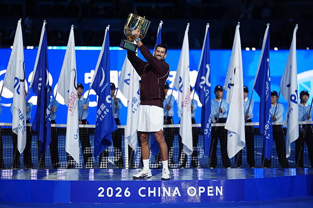 BEIJING, CHINA - OCTOBER 6: Novak Djokovic of Serbia pose with the trophy after winning against Alex De Minaur of Australia during their Men's Singles final match on day seven of China Open at the National Tennis Center on October 6, 2026 in Beijing, China. (Photo by Fred Lee/Getty Images)