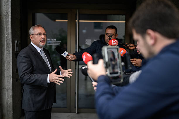 Court of Arbitration of Sport (CAS) director general Matthieu Reeb speaks to media during a hearing on Senegal's appeal against Morocco following a chaotic Africa Cup of Nations football final, in Lausanne on October 8, 2026. Nearly ten months after a chaotic Africa Cup of Nations final, the dispute is set to reach its conclusion in Lausanne, where the Court of Arbitration for Sport (CAS) will hear Senegal's appeal against Morocco being awarded the title. Senegal had initially won the January 18 final 1-0 after extra time, in a match marred by a lengthy walk-off over a controversial late penalty. (Photo by Fabrice COFFRINI / AFP via Getty Images)