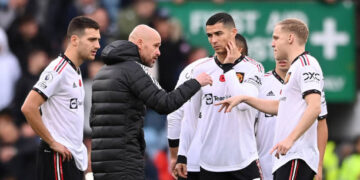 Cristiano Ronaldo of Manchester United listens as manager Erik ten Hag gives instructions in the centre circle of the pitch prior to the second half starting during the Premier League match between Aston Villa and Manchester United at Villa Park on November 06, 2022 in Birmingham, England. (Photo by Stu Forster/Getty Images)
